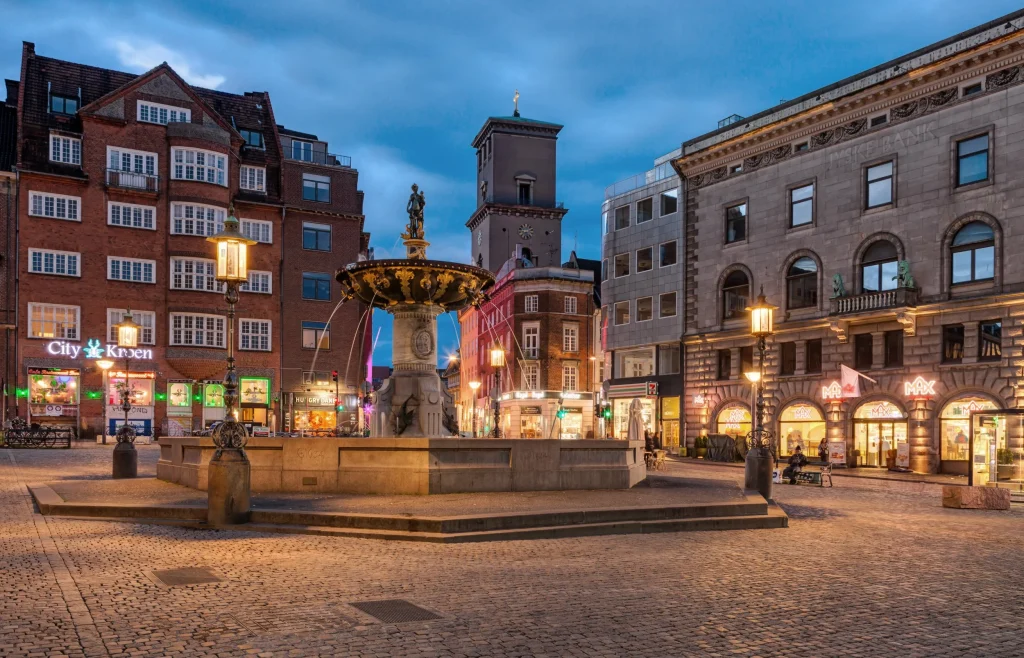 Gammeltorv square at dusk, a minute from the clinic in central Copenhagen